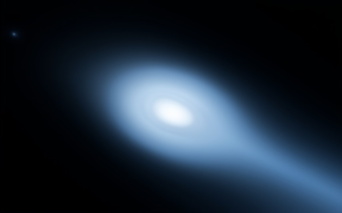A soft blue glowing coma with a bright core, trailing a broad blue haze to the lower right, an impression of the interstellar comet 3I/ATLAS.