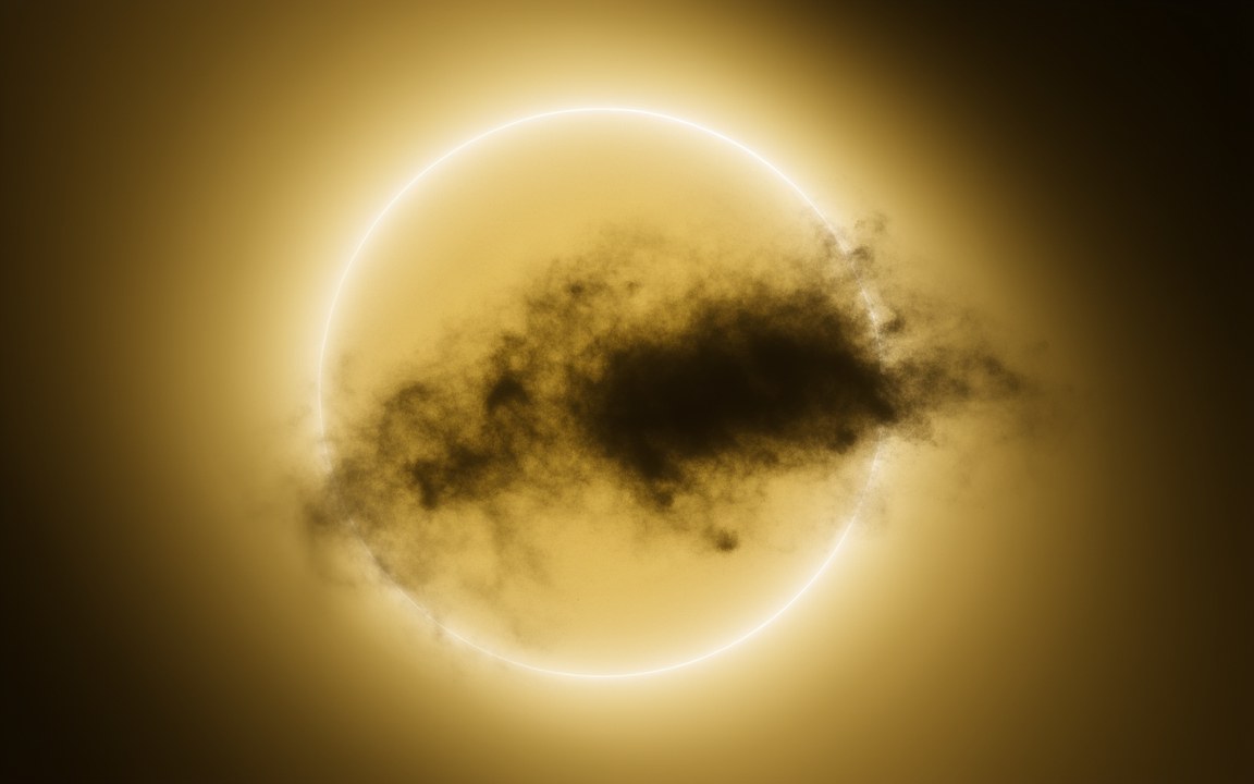 A glowing yellow-white star with a ragged dark cloud of dust drifting across its face, an impression of Tabby's Star during one of its dips.