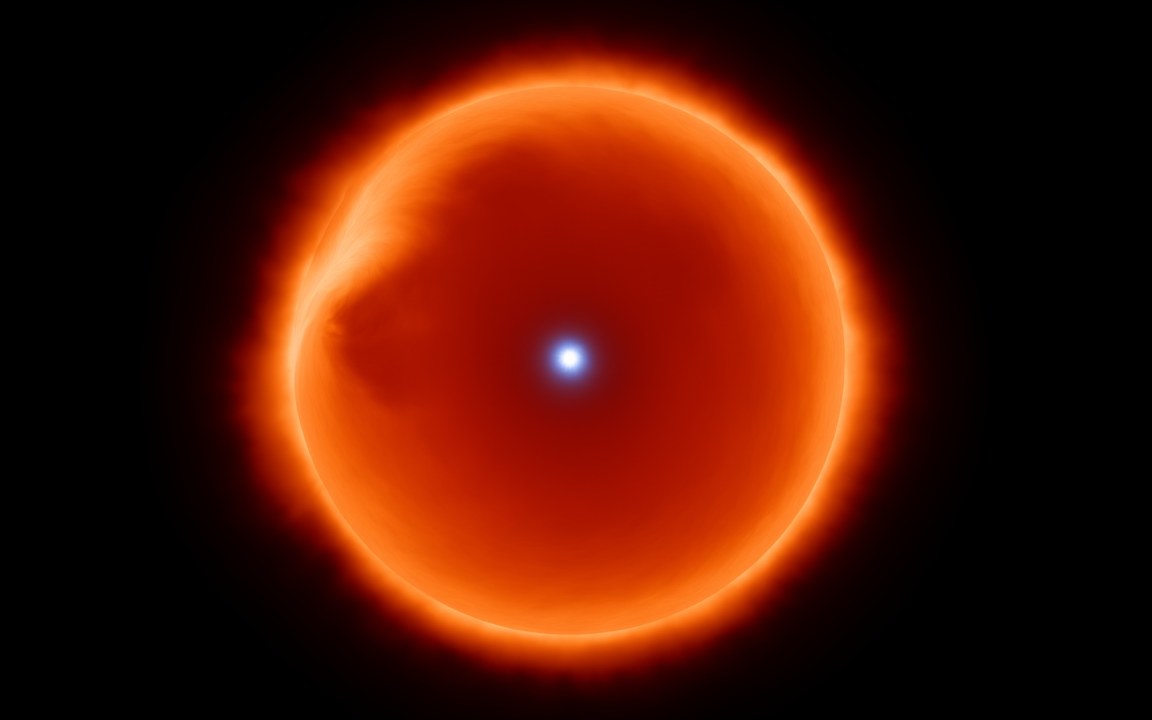 A glowing orange shell of gas with a tiny, intensely bright blue-white point at its centre, an impression of a Thorne–Żytkow object, a neutron star hidden inside a red supergiant.
